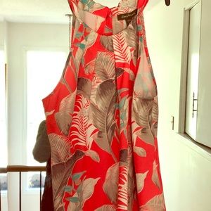 Sleeveless flowy floral tie neck top.